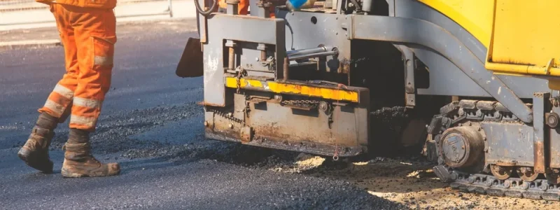 Asphalt,Paver,Roadworker,Operator,In,Hi-viz,Laying,New,Road,Surface